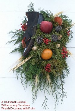 A traditional Colonial Williamsburg Christmas wreath decorated with fruits