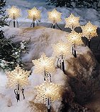 Line the pathway with ‘snowflake’ or ‘star-shaped’ lights available in most stores.
