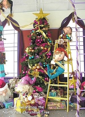 Elves decorating the North Pole Christmas Tree